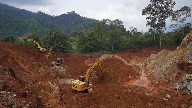 Excavators in a pit at a nickel mine operated by PT Teknik Alum Service in Morowali Regency, Central Sulawesi, Indonesia, on Thursday, March 17, 2022. Indonesia, the world’s top nickel producer, will raise production capacity of the metal after prices soared past $100,000 a ton, while the coal market is unlikely to get similar relief.
