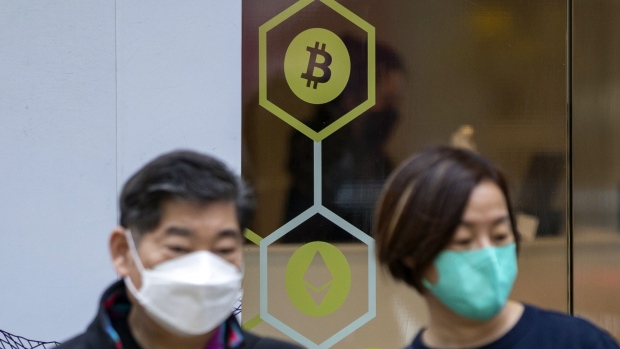Signage for Bitcoin and Ethereum at a Genesis Block cryptocurrency exchange in Hong Kong, China, on Friday, March 25, 2022. Bitcoin climbed to more than $44,000 for the first time in almost a month, breaking out of its recent narrow trading range amid a renewal of risk appetite. Photographer: Paul Yeung/Bloomberg