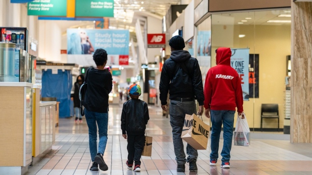 Customers carry Nike shopping bags at a shopping mall in Anne Arundel, Maryland, US, on Wednesday Nov. 9, 2022. The US Census Bureau is scheduled to release retail sales figures on November 16.