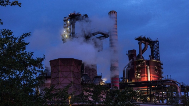 Emissions rise from chimneys at the Thyssenkrupp AG steel plant at dawn in Duisburg, Germany, on Tuesday, Oct. 20, 2020. Liberty Steel said it's made a non-binding indicative offer for Thyssenkrupp's steel unit, as the German conglomerate continues restructuring efforts to ensure its survival. Photographer: Sarah Pabst/Bloomberg