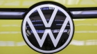 The badge of a Volkswagen ID Buzz electric microbus at the Volkswagen AG (VW) multipurpose and commercial vehicle plant in Hannover, Germany, on Thursday, June 16, 2022. Europe's biggest automaker is set to become the world's biggest electric-car maker, inching past rival Tesla Inc. by 2024, according to Bloomberg Intelligence. Photographer: Alex Kraus/Bloomberg