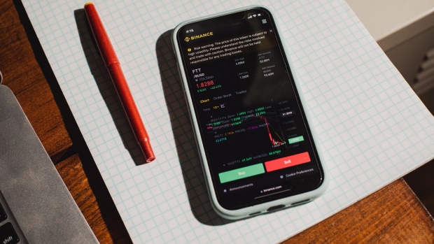 The FTX Token FTT data on the Binance cryptocurrency exchange website on a smartphone arranged in the Brooklyn borough of New York, US, on Wednesday, Nov. 16, 2022. Reverberations from the collapse of Sam Bankman-Fried’s empire continue to spread through financial markets, threatening the future of crypto lenders like BlockFi Inc. and Voyager Digital Ltd. Photographer: Lanna Apisukh/Bloomberg