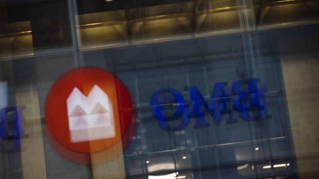 Bank of Montreal (BMO) signage is reflected on a surface in the financial district of Toronto, Ontario, Canada, on Thursday, July 25, 2019. Canadian stocks fell as tech heavyweight Shopify Inc. weighed on the benchmark and investors continued to flee pot companies. Photographer: Brent Lewin/Bloomberg