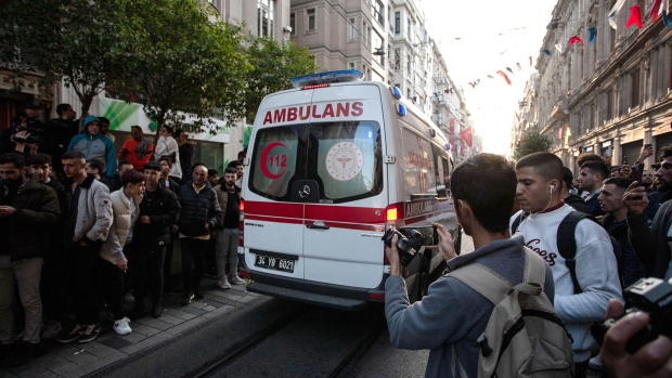 An ambulance leaves the blast site of an explosion on Istiklal street in Istanbul on Nov. 13.