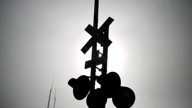 A railroad crossing gate is seen along tracks owned by CSX Corp. in Worthville, Kentuck.
