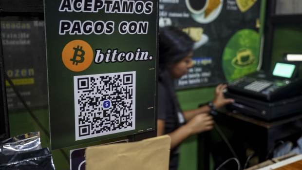 A Bitcoin sign at a coffee shop on the one-year anniversary of Bitcoin adoption in Ahuachapan, El Salvador, on Wednesday, Sept. 7, 2022. One year into El Salvador's adoption of Bitcoin as legal tender, and more than 2,000 BTC bought by the government at near highs, the nation has lost more than half the value of its cryptocurrency purchases so far. Photographer: Camilo Freedman/Bloomberg