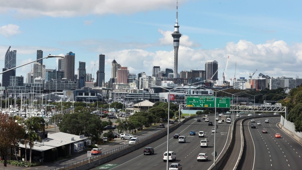 Vehicles travel along a road in Auckland, New Zealand, on Monday, April 11, 2022. New Zealand’s central bank will raise interest rates for a fourth straight meeting, seeking to rein in the fastest inflation in more than 30 years even as risks of an economic downturn mount. Photographer: Fiona Goodall/Bloomberg