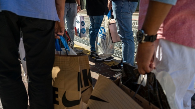 Shoppers carry bags in San Francisco.