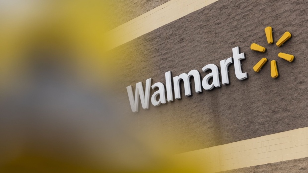 Signage outside a Walmart store in Albany, New York, U.S., on Thursday, Feb. 17, 2022. Walmart Inc. surpassed Wall Street’s quarterly profit expectations and unveiled an upbeat sales outlook for the current fiscal year despite persistent cost pressures and flagging consumer sentiment.
