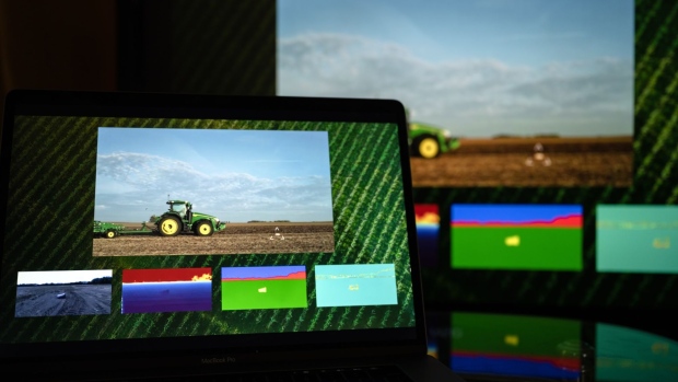 Technology for an autonomous tractor is displayed during a John Deere live-streamed event at the CES 2022 trade show in Las Vegas, Nevada, U.S., on Tuesday, Jan. 4, 2022. Organizers of the tech conference, under fire for not canceling the event during a Covid-19 surge, said they will close the expo one day early as "an additional safety measure."