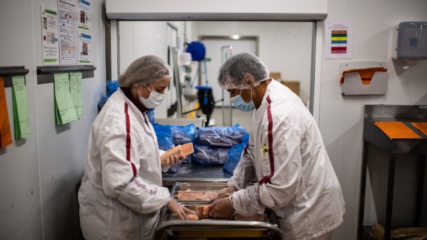 Elior employees cook meals in the organisations central kitchen at Epone, west of Paris, on September 3, 2020.  Photographer: Martin Bureau/AFP/Getty Images