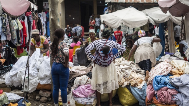 Vendors wait for customers at the Kantamanto textile market in Accra, Ghana, on Thursday, Sept. 15, 2022. The rise of fast fashion—and shoppers’ preference for quantity over quality—has led to a glut of low-value clothing that inordinately burdens developing countries.