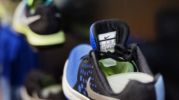 A label that reads "Made In Vietnam" is seen on the tongue of a sports shoe on display in a Nike Inc. store at the Lotte Shopping Plaza in Hanoi, Vietnam, on Tuesday, Jan. 24, 2017. President Donald Trump's decision not to join the Trans-Pacific Partnership and pledge to renegotiate the North American Free Trade Agreement are forcing companies to rethink supply chains and capital investments in a new era of protectionist policies. His moves weigh heavily on importers such as Nike and Ford Motor Co. as he seeks to boost domestic manufacturing and create jobs. Photographer: Maika Elan/Bloomberg