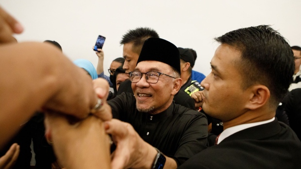 Anwar Ibrahim, Malaysia’s prime minister, greets supporters during a news conference in Cheras, Selangor, Malaysia, on Thursday, Nov. 24, 2022. Anwar finally became Malaysia’s prime minister, capping a tumultuous political career that veered from coming close to clinching the top job on more than one occasion to spending years in prison on sodomy charges.