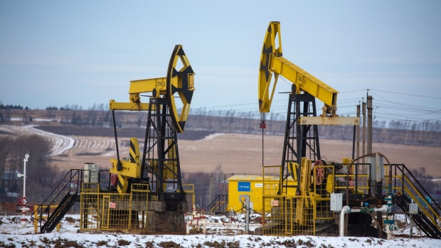 Oil pumping jacks, also known as "nodding donkeys" in a Rosneft Oil Co. oilfield near Sokolovka village, in the Udmurt Republic, Russia, on Friday, Nov. 20, 2020. The flaring coronavirus outbreak will be a key issue for OPEC+ when it meets at the end of the month to decide on whether to delay a planned easing of cuts early next year. Photographer: Andrey Rudakov/Bloomberg