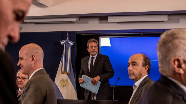 Sergio Massa, Argentina's economy minister, center, during a press conference at the Economy Ministry building in Buenos Aires, Argentina, on Wednesday, Aug. 3, 2022. New Economy Minister Massa is preparing a set of measures to address one of Argentina’s key problems: a chronic shortage of dollars that has caused the US currency to soar in parallel exchange markets.