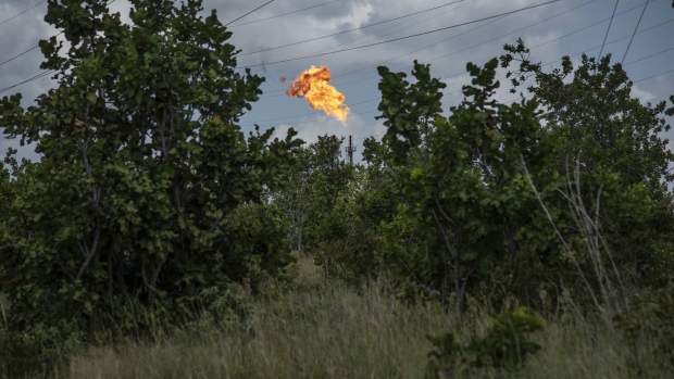 A gas flare burns at a Petroleos de Venezuela SA (PDVSA) facility in El Tigre, Venezuela, on Sunday, Oct. 14, 2018. State-owned PDVSA doesn't publish statistics, but environmentalists and analysts keep seemingly endless lists of examples of wayward crude - unleashed by busted valves, ripped gaskets, and cracked pipes - that they say has polluted waterways and farmland and probably has seeped into the nation's aquifers.