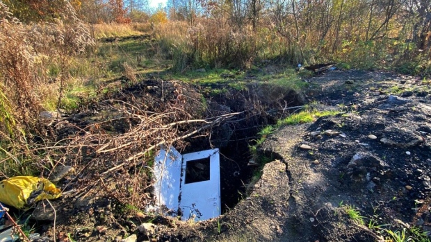An illegal mining site in fields surrounding a residential area of Walbrzych, Poland.