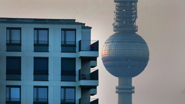 The Fernsehturm TV tower stands in view of the balconies on a residential apartment block in the Friedrichshain district of Berlin, Germany, on Wednesday, Oct. 23, 2019. Berlin’s governing parties struck a deal to freeze rents for five years, marking one of the most radical plans to tackle spiraling housing costs in a major city and hitting the shares of major apartment owners. Photographer: Krisztian Bocsi/Bloomberg