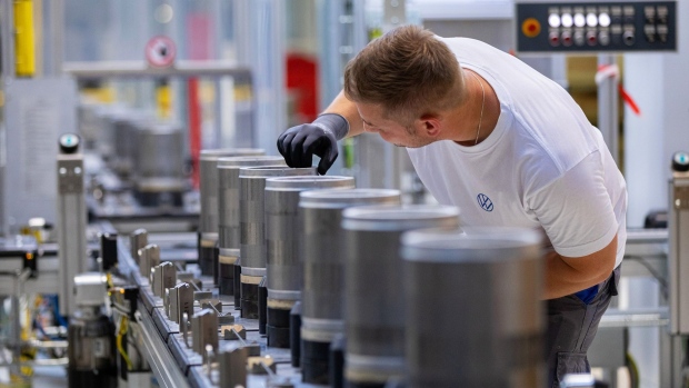 An employee checks the finished components on the electric motor rotor production line at the SalzGiga fuel cell gigafactory, operated by Volkswagen Group Components, in Salzgitter, Germany, on Wednesday, May 18, 2022. VW’s future battery hub at Salzgitter will start production in 2025 for the company’s volume cars. Photographer: Krisztian Bocsi/Bloomberg