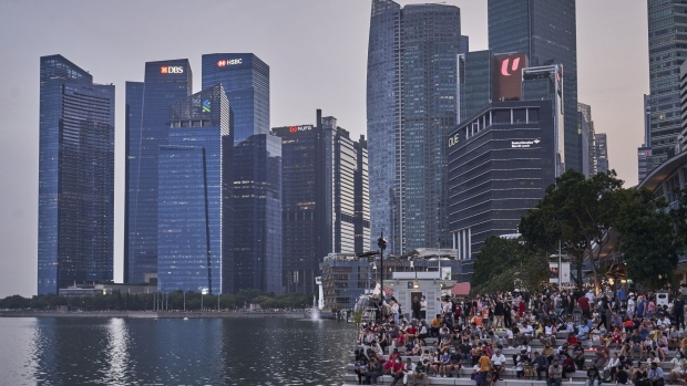 Crowds by the Merlion in Singapore, on Saturday, July 9, 2022. Singapore is scheduled to announce its second quarter advanced gross domestic product (GDP) estimate on July 14, 2022. Singapore is scheduled to release second quarter advance gross domestic product (GDP) estimates on July 14.