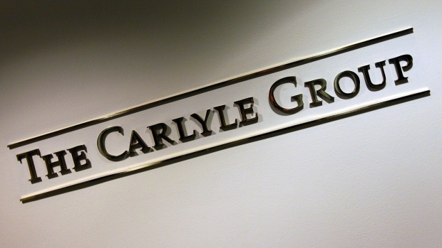 WASHINGTON, DC - SEPTEMBER 06: A sign for the Carlyle Group, a private equity firm, is seen after the company filed papers with the Securities and Exchange Commission for a $100 million IPO on September 6, 2011 in Washington, DC. The firm manages approximately $150 billion in assets and is expected to hold their IPO late this year, or early next year. (Photo by Win McNamee/Getty Images)