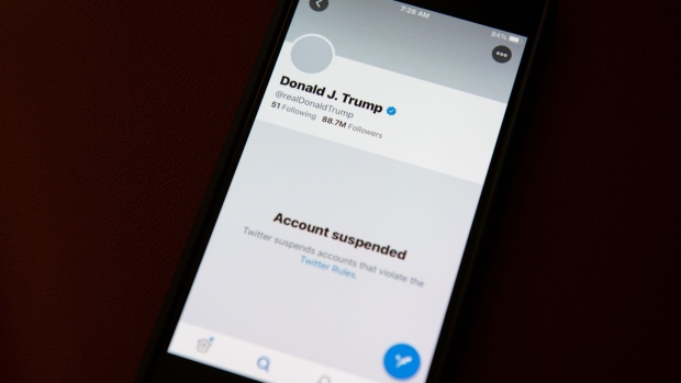The suspended Twitter Inc. account of U.S. President Donald Trump on a smartphone arranged in Washington, D.C., U.S., on Saturday, Jan. 9, 2021. Twitter permanently banned Trump's personal account on Friday for breaking its rules against glorifying violence, marking the most high-profile punishment the social-media company has ever imposed and the end of Trump's relationship with his favorite social media megaphone.
