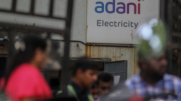 Sign of Adani Electricity Mumbai Ltd.'s bill payment center in Mumbai, India, on Tuesday, Sep. 6, 2022. Adani Group, indirectly acquired a 29.2% stake in New Delhi Television Ltd., or NDTV, and offered to buy another 26% from the open market for a combined 6.07 billion rupees ($76 million) in August 2022. Photographer: Dhiraj Singh/Bloomberg