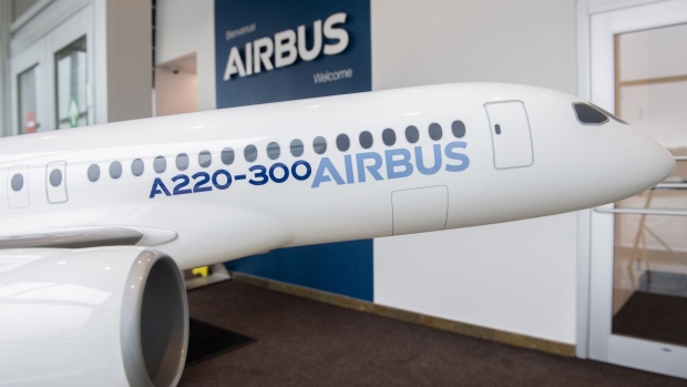 A model Airbus A220-300 at the Airbus Canada LP pre-assembly plant in Mirabel, Quebec, Canada, on Thursday, April 14, 2022. Airbus has added 125,000 square feet of additional space in Mirabel, designed to support the A220 production ramp up capacity, which is expected to more than double in the next few years.
