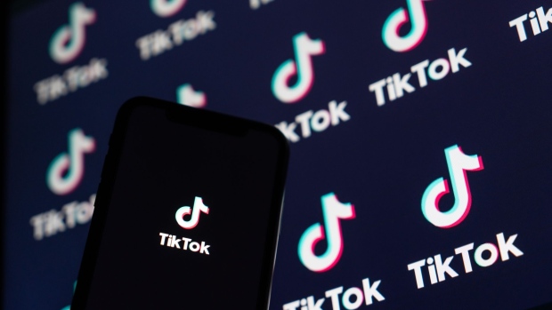 The logo for ByteDance Ltd.'s TikTok app is displayed on a smartphone in an arranged photograph in Beijing, China, on Wednesday, Sept. 2, 2020. U.S. President Donald Trump said he's told people involved in the sale of the U.S. assets of ByteDance's TikTok that the deal must be struck by Sept. 15 and the federal government must be "well compensated," or the service will be shut down. Photographer: Yan Cong/Bloomberg