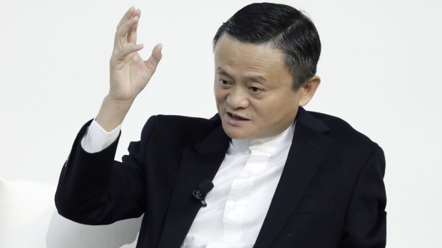 Jack Ma, former chairman of Alibaba Group Holding Ltd., gestures while speaking during a dialog session with Masayoshi Son, chairman and chief executive officer of SoftBank Group Corp., not pictured, at Tokyo Forum 2019 in Tokyo, Japan, on Friday, Dec. 6, 2019. Son unveiled a $184 million initiative Friday to accelerate artificial intelligence research in Japan, enlisting Ma to expound on his goal of commercializing the technology. Son's company announced a partnership with the University of Tokyo that includes spending 20 billion yen ($184 million) over 10 years by mobile arm SoftBank Corp. to establish the Beyond AI Institute.
