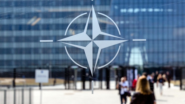 The NATO Star logo sits on a glass panel during the military and political alliance's summit at the North Atlantic Treaty Organization (NATO) headquarters in Brussels, Belgium, on Thursday, July 12, 2018. In an unexpected twist, NATO leaders held an unplanned emergency session on the last day of their two-day summit, which has been upended by U.S. President Donald Trump's attacks on allies over defense spending. Photographer: Bloomberg/Bloomberg