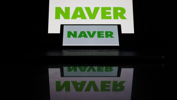 The Naver Corp. logo arranged on a smart phone and screen in Gimpo, South Korea, on Thursday, Sept. 9, 2021. Kakao Corp. and Naver plummeted, set for the biggest declines in years, after South Korean lawmakers warned the nation’s internet giants against abusing their market dominance in the pursuit of profits. Photographer: SeongJoon Cho/Bloomberg