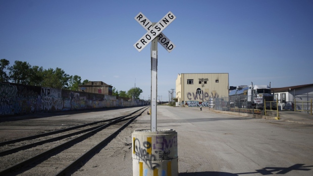 A railroad crossing crossbuck in St. Louis, Missouri. Photographer: Luke Sharrett/Bloomberg