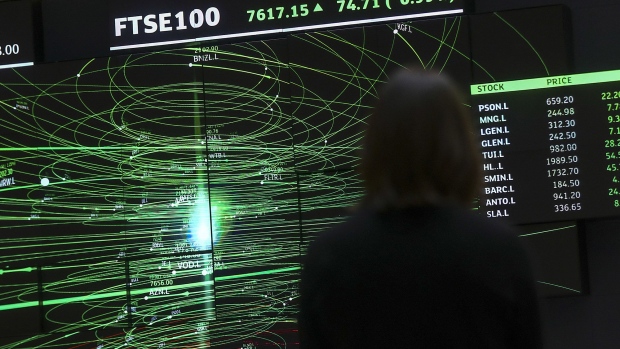 A FTSE share index board in the atrium of the London Stock Exchange. 