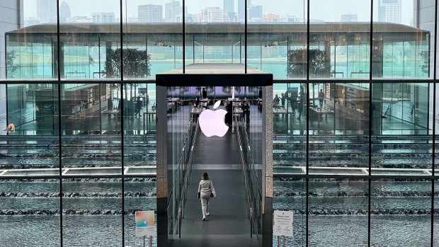 A shopper enters the Apple Inc. store in The Galleria shopping complex on Al Maryah Island in Abu Dhabi, United Arab Emirates, on Sunday, April 10, 2022. Abu Dhabi regulators approved a framework for special purpose acquisition companies, looking to capture some of the blank-check boom that has gripped global markets for the past two years. Photographer: Christopher Pike/Bloomberg