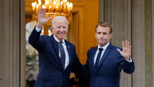 French President Emmanuel Macron (R) welcomes US President Joe Biden (L) before their meeting at the French Embassy to the Vatican in Rome on October 29, 2021. Photographer: Ludovic Marin/AFP/Getty Images