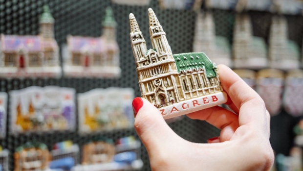 A Zagreb Cathedral magnet held by a customer at a souvenir store in Zagreb, Croatia, on Monday, Sept. 19, 2022. Croatia's government earlier this month approved an aid package worth 21 billion kuna ($2.8 billion) to ease the effects of the energy crisis and are seeking to raise minimum pension levels and increase assistance to families with children. Photographer: Petar Santini/Bloomberg