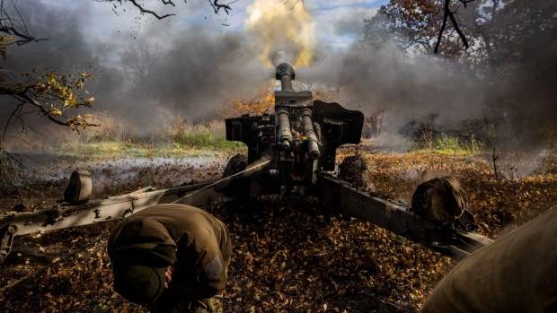 Ukrainian artillerymen fire a D20 artillery piece in Ukraine’s Donetsk region, on October 31. Photographer: Dimitar Dilkoff/AFP/Getty Images