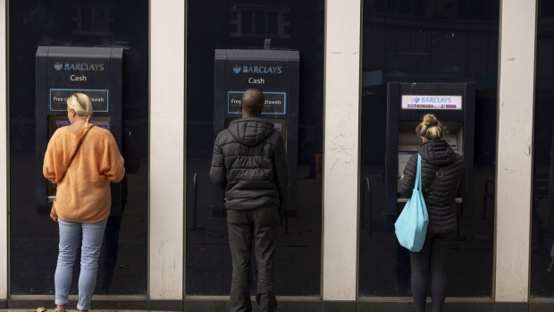 ATMs outside a Barclays Plc bank branch in London. Photographer: Jason Alden/Bloomberg