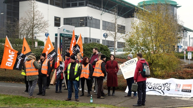 MILTON KEYNES, ENGLAND - NOVEMBER 23: Members and supporters of the GMB union protest outside the Amazon offices as the company holds it's annual Black Friday sales, on November 23, 2018 in Milton Keynes, England. Amazon workers in Italy and Spain are also expected to holds demonstrations for 24 hours in a joint protest against working conditions in the fulfillment centres of the online retail giant. (Photo by Leon Neal/Getty Images)