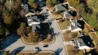 Homes in a subdivision in Atlanta, Georgia, US, on Sunday, Nov. 13, 2022. Redfin Corp. is shuttering its iBuying business and laying off workers for the second time in almost five months, as the likelihood of a prolonged US housing slowdown continues to ripple through the industry.