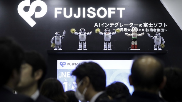Fujisoft Inc. Palro robots perform at the company's booth at the Artificial Intelligence Exhibition & Conference in Tokyo, Japan, on Wednesday, April 4, 2018. The AI Expo will run through April 6.