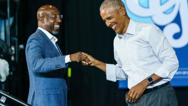 ATLANTA, GA - OCTOBER 28: Former President Barack Obama greets Sen. Raphael Warnock (D-GA) as he arrives at a campaign event for Georgia Democrats on October 28, 2022 in College Park, Georgia. Obama is in Georgia in support of Democratic candidates, encouraging voters to turn out. (Photo by Elijah Nouvelage/Getty Images)