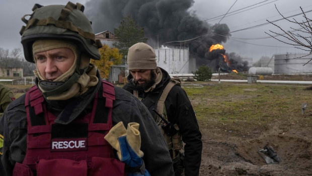 Inspections after an attack on an oil reserve in Kherson. Photographer: Bulent Kilic/AFP/Getty Images
