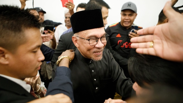 Anwar Ibrahim, Malaysia’s prime minister, greets supporters during a news conference in Cheras, Selangor, Malaysia, on Thursday, Nov. 24, 2022. Anwar finally became Malaysia’s prime minister, capping a tumultuous political career that veered from coming close to clinching the top job on more than one occasion to spending years in prison on sodomy charges.