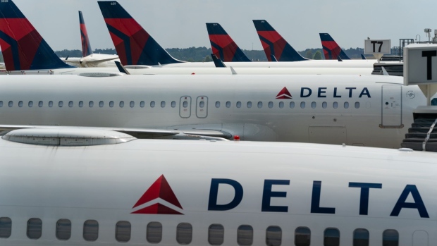 Delta Air Lines Inc. planes parked at gates at Hartsfield-Jackson Atlanta International Airport in Atlanta, Georgia, U.S., on Wednesday, April 7, 2021. U.S. airlines are bringing back more pilots as they prepare for an expected travel rebound. Photographer: Elijah Nouvelage/Bloomberg