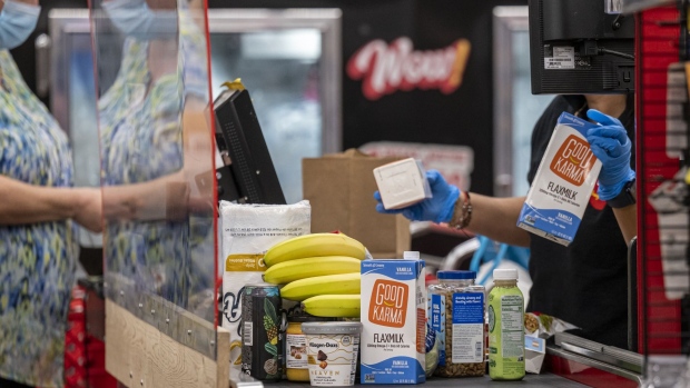 A customer checks out at a grocery store in San Francisco, California, U.S., on Thursday, Nov. 11, 2021. U.S. consumer prices rose last month at the fastest annual pace since 1990, cementing high inflation as a hallmark of the pandemic recovery and eroding spending power even as wages surge.