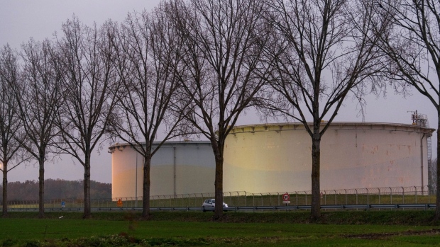 Storage silos at the TotalEnergies SE Grandpuits oil refinery in Grandpuits-Bailly-Carrois, France, on Thursday, Dec. 1, 2022. European Union states are coalescing around a plan to cap the price of Russian crude oil at $60 a barrel, their latest attempt to clinch an agreement before a Monday deadline, according to people familiar with the matter. Photographer: Benjamin Girette/Bloomberg