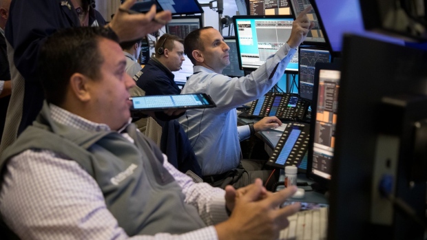 Traders work on the floor of the New York Stock Exchange (NYSE) in New York, US, on Wednesday, Nov. 9, 2022. US stocks declined following midterm elections that failed to yield a Republican sweep. Treasuries and the dollar caught bids in a sign of deteriorating risk sentiment.